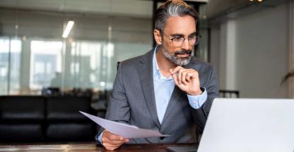 An accountant paying invoices