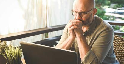 A bank customer reading about wire fraud