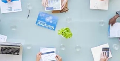 Birdseye view of people working at a shared desk