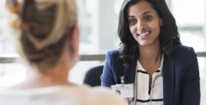 Female healthcare provider speaking to a female patient