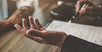 Hands over a document