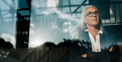 Businesswoman looking out of office window