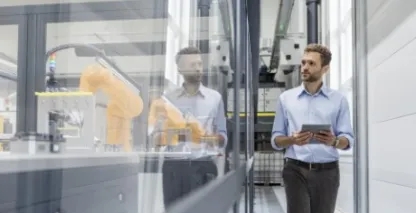Man holding tablet in a factory