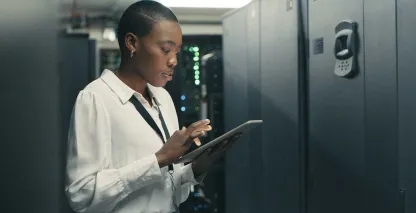 An IT professional working in a server room